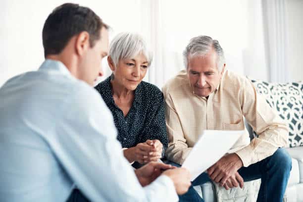 Shot Of A Senior Couple Getting Advice From Their Financial Consultant At Home Istockphoto 861129272 612X612 1 - Springbrook Assisted Living
